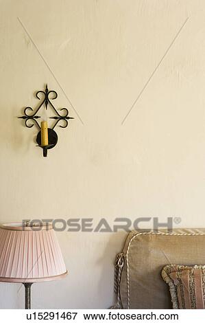 Wrought iron wall sconce with candle View Large Photo Image Stock Photo - Wrought iron wall sconce with candle. Fotosearch