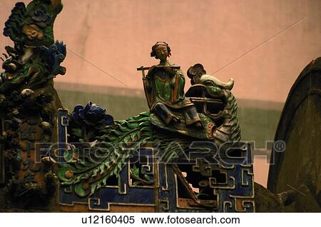 Stock Photography - Sculptures at the roof of temple. Fotosearch