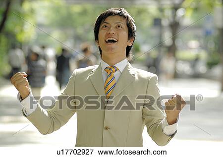 Business lady clenching fists in triumph View Large Photo Image Stock Photo - Business lady clenching fists in triumph. Fotosearch