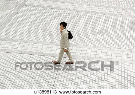 Stock Image - Businessman moving. Fotosearch