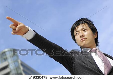 Businessman pointing a finger View Large Photo Image Stock Photo - Businessman pointing a finger. Fotosearch
