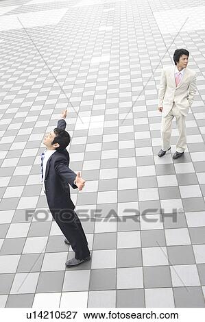 Stock Photo - Businessman stretching itself. Fotosearch
