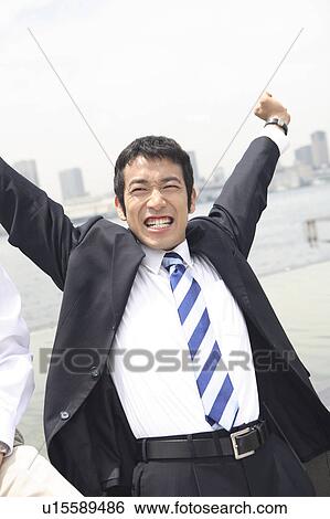Stock Photograph - Businessman stretching itself. Fotosearch