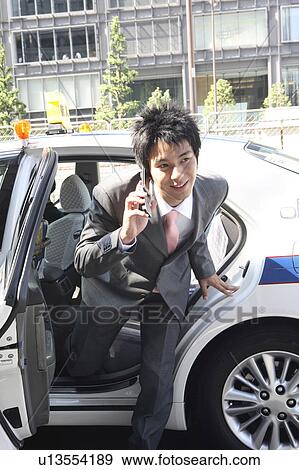 Office worker who goes out of the taxi View Large Photo Image Stock Photo - Office worker who goes out of the taxi. Fotosearch