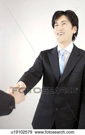 Office worker who shakes hands View Large Photo Image Stock Photo - Office worker who shakes hands. Fotosearch