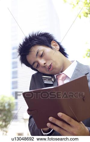 Office worker who takes notes View Large Photo Image Stock Image - Office worker who takes notes. Fotosearch