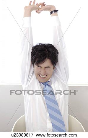 Stock Photo - Overstretching oneself office worker. Fotosearch