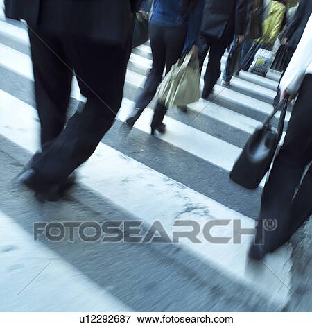 Group of people crossing zebra crossing View Large Photo Image Stock Photo - Group of people crossing zebra crossing. Fotosearch