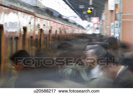 Group of people getting on a train View Large Photo Image Stock Photo - Group of people getting on a train. Fotosearch