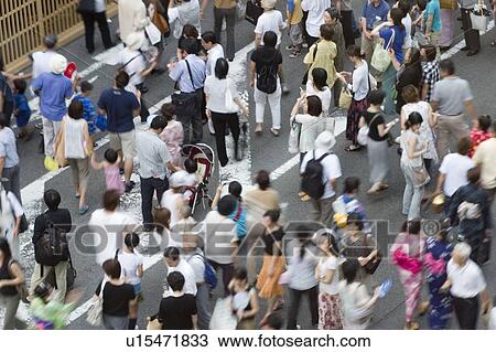 Stock Image - Group of people visiting summer festival in Japan. Fotosearch