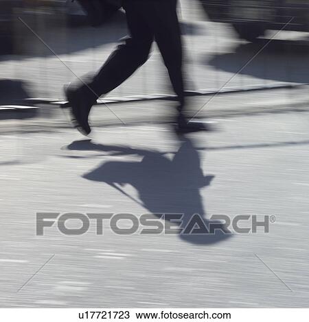 Low section of a businessman, blurred motion View Large Photo Image Stock Image - Low section of a businessman, blurred motion. Fotosearch