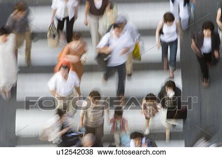 Stock Photo - People crossing street in Japan. Fotosearch