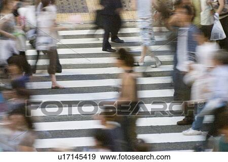 Stock Photo - People crossing street in Japan. Fotosearch