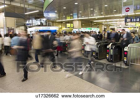Stock Image - People exiting from a station. Fotosearch