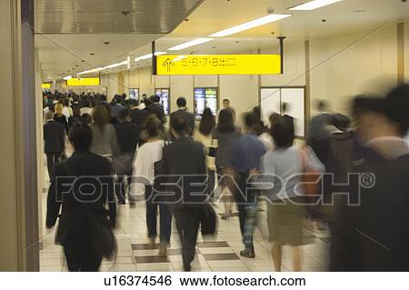 People walking in a station View Large Photo Image Stock Photograph - People walking in a station. Fotosearch