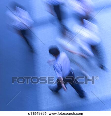 Stock Photography - People walking on street, blurred motion. Fotosearch