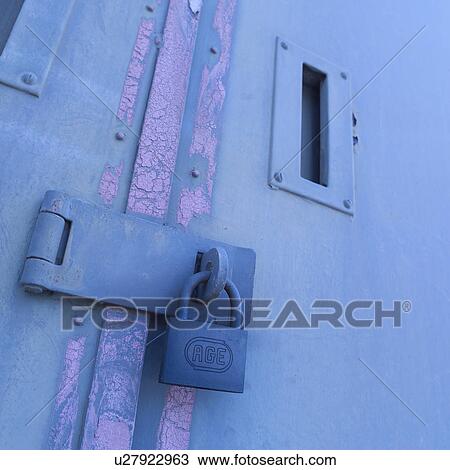 Stock Image - Padlock attached to door. Fotosearch
