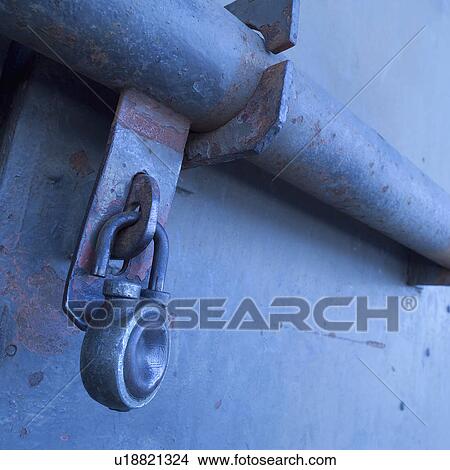 Rusty door and padlock, close-up View Large Photo Image Picture - Rusty door and padlock, close-up. Fotosearch