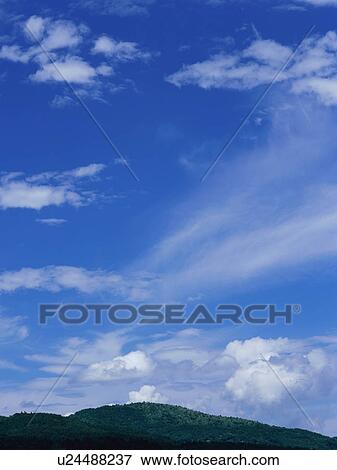 Stock Photo - Green field and sky. Fotosearch