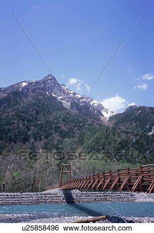 Stock Photograph - Myojin Bridge in Kamikochi, Nagano Prefecture, Japan. Fotosearch