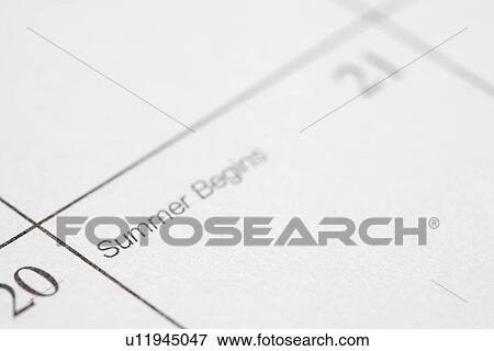 Stock Photo - Close up of calendar displaying the beginning of summer. Fotosearch