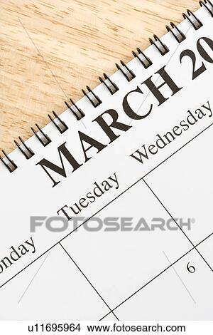 Close up of spiral bound calendar displaying month of March View Large Photo Image Picture - Close up of spiral bound calendar displaying month of March. Fotosearch