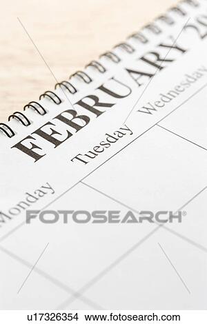 Close up of spiral bound calendar displaying month of February View Large Photo Image Picture - Close up of spiral bound calendar displaying month of February. Fotosearch