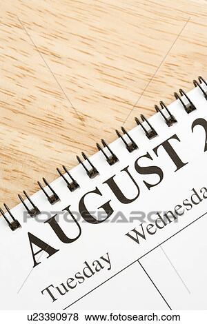 Close up of spiral bound calendar displaying month of August View Large Photo Image Stock Photo - Close up of spiral bound calendar displaying month of August. Fotosearch