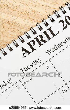 Close up of spiral bound calendar displaying month of April View Large Photo Image Stock Photograph - Close up of spiral bound calendar displaying month of April. Fotosearch