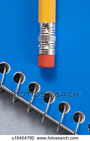 Close up of eraser end of pencil placed on blue spiral bound notebook. View Large Photo Image Stock Image - Close up of eraser end of pencil placed on blue spiral bound notebook.. Fotosearch