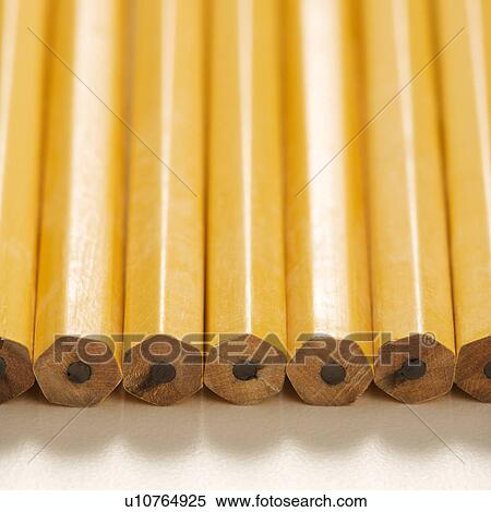 Close up of group of new unsharpened pencils lined up in an even row View Large Photo Image Stock Photography - Close up of group of new unsharpened pencils lined up in an even row. Fotosearch