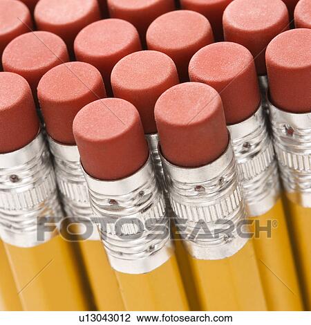 Stock Image - Close up of group of pencil erasers. Fotosearch