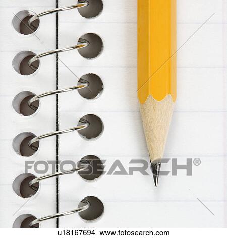 Picture - Close up of pencil on top of spiral bound notebook. Fotosearch