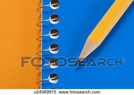 Sharp pencil placed on blue spiral bound notebook View Large Photo Image Stock Photography - Sharp pencil placed on blue spiral bound notebook. Fotosearch