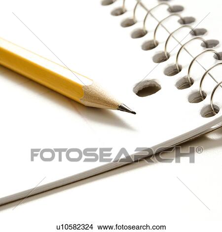 Picture - Sharp pencil placed on open spiral bound notebook. Fotosearch