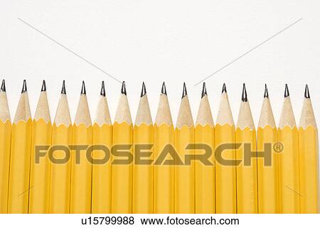 Sharp pencils lined up in an even row View Large Photo Image Stock Photo - Sharp pencils lined up in an even row. Fotosearch