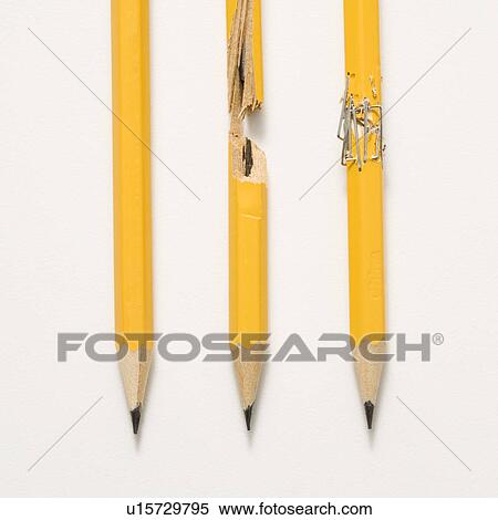 Stock Photography - Whole pencil, broken pencil and stapled together pencil lined up against white background.. Fotosearch
