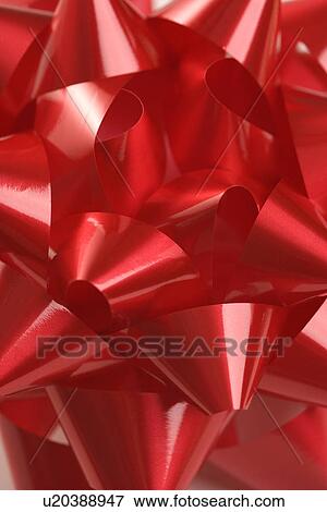Close-up of big red Christmas bow View Large Photo Image Stock Photo - Close-up of big red Christmas bow. Fotosearch