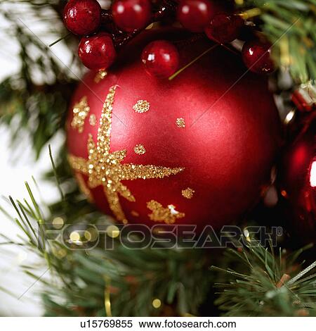 Close up of red ornament and berries on Christmas wreath. View Large Photo Image Stock Photography - Close up of red ornament and berries on Christmas wreath.. Fotosearch