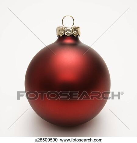 Stock Image - Still life of red Christmas ornament. Fotosearch