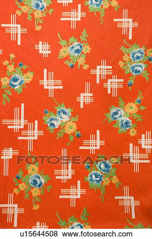 Stock Photo - Close-up of red vintage fabric with colorful flowers printed on polyester. Fotosearch