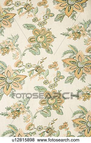 Close-up of vintage fabric with golden flowers and green leaves printed on polyester View Large Photo Image Stock Photo - Close-up of vintage fabric with golden flowers and green leaves printed on polyester. Fotosearch