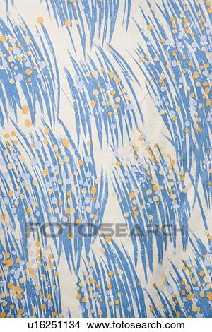 Picture - Close-up of vintage fabric with abstract blue and yellow brushstrokes printed on polyester. Fotosearch