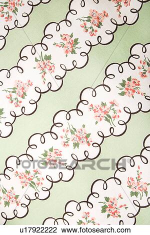 Stock Image - Close-up of vintage fabric with pink flowers in wide stripes printed on polyester. Fotosearch