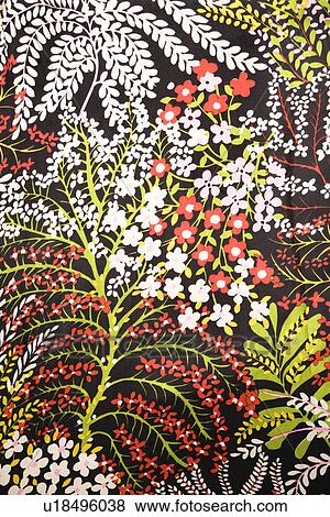 Stock Photo - Close-up of vintage fabric with red green and white flowers printed on polyester. Fotosearch