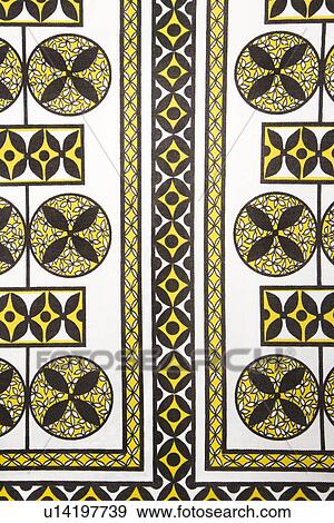 Stock Photo - Vintage fabric with black and yellow shapes and patterns printed on polyester. Fotosearch