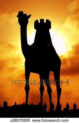 Stock Image - silhouette, dubai, camel, sunset, sunrise. Fotosearch