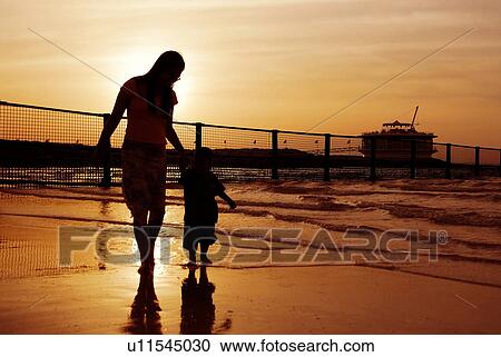 Stock Image - silhouette, dubai, beach, jumeirah, mother, child. Fotosearch