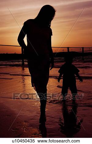 Stock Photography - silhouette, mother, child, beach. Fotosearch