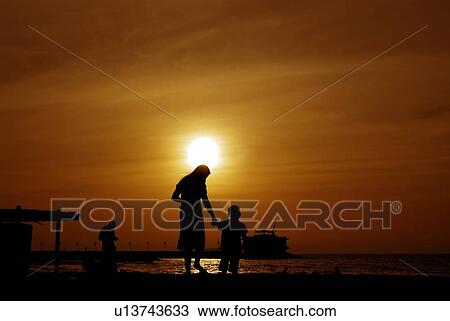 sunset, sunrise, rise, dubai, beach, happy, familly View Large Photo Image Stock Image - sunset, sunrise, rise, dubai, beach, happy, familly. Fotosearch